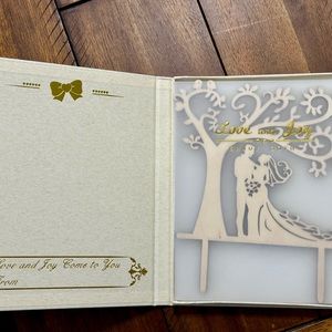 Love and Joy branded wooden cake topped. Never used.